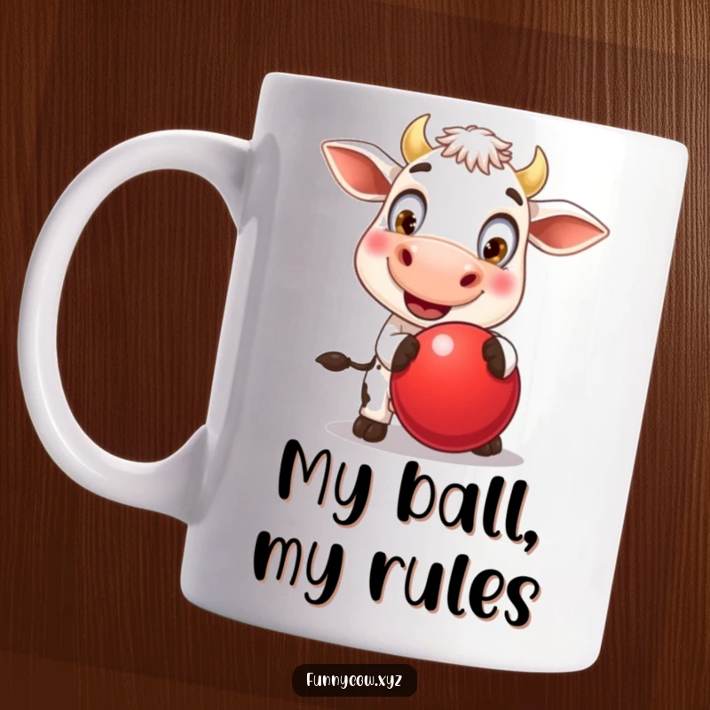 Funny mug showcasing a cheerful cow with huge, expressive eyes, joyfully bouncing a vibrant red ball, radiating pure, unadulterated fun.