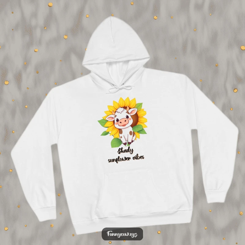 Funny hoodie featuring a timid spotted cow peeking out from the shade of an enormous sunflower, conveying gentle curiosity.