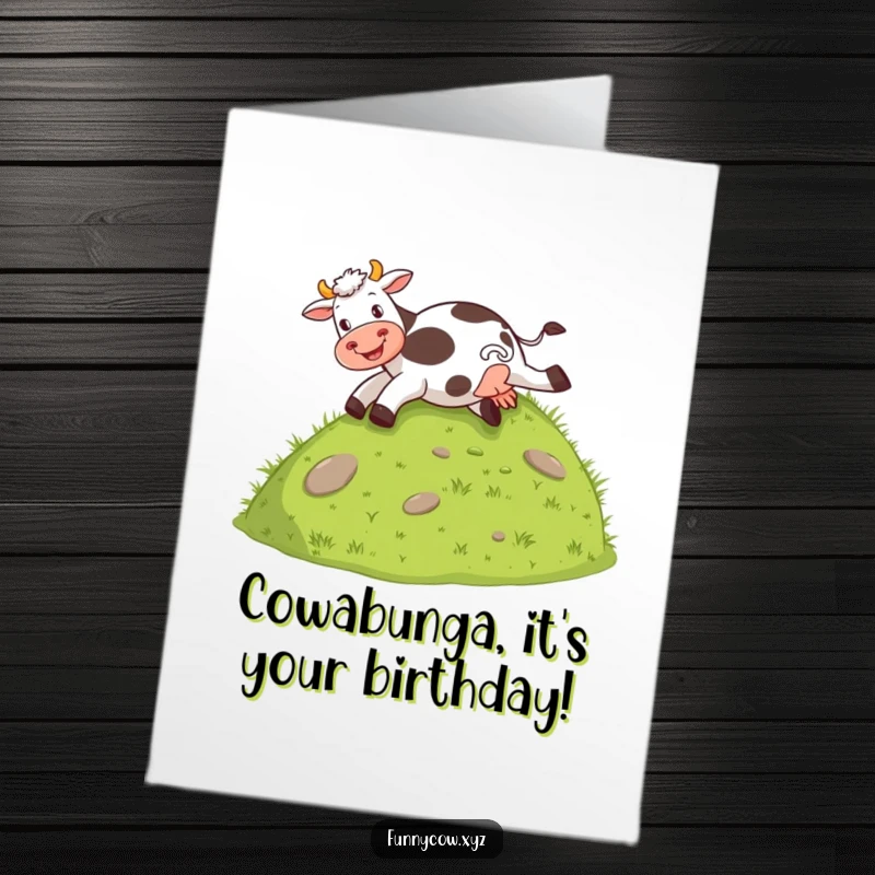 Funny Free Printable Birthday Card of a happy cow joyfully sliding down a grassy hill on its bottom, spreading birthday cheer.