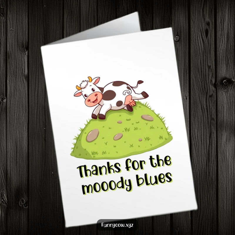 Funny Free Printable Thank You Card of a cow happily sliding down a grassy hill on its rear, humorously showing thanks.
