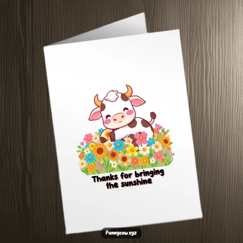 Funny Free Printable Thank You Card: A cow joyfully luxuriates in a pile of colorful flowers, expressing gratitude.