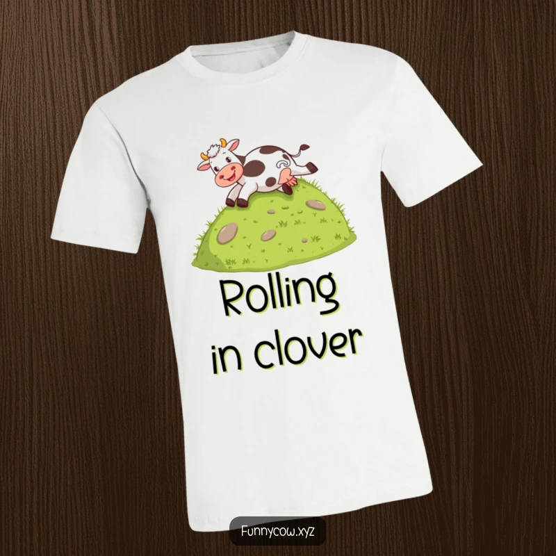 Funny T-shirt featuring a cow joyfully sliding down a grassy hill on its behind, a whimsical farm scene.