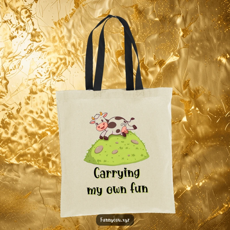 Funny tote bag with a cow joyfully sliding down a grassy hill on its behind, a whimsical carry-all.